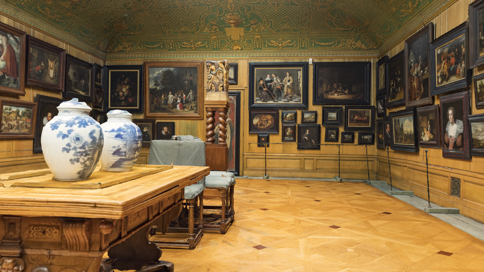 The Picture Gallery: a long top-lit room hung edge to edge with Dutch and Flemish paintings